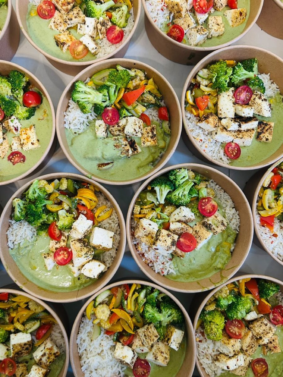 A tray of pesto paneer bowls packed fresh that morning